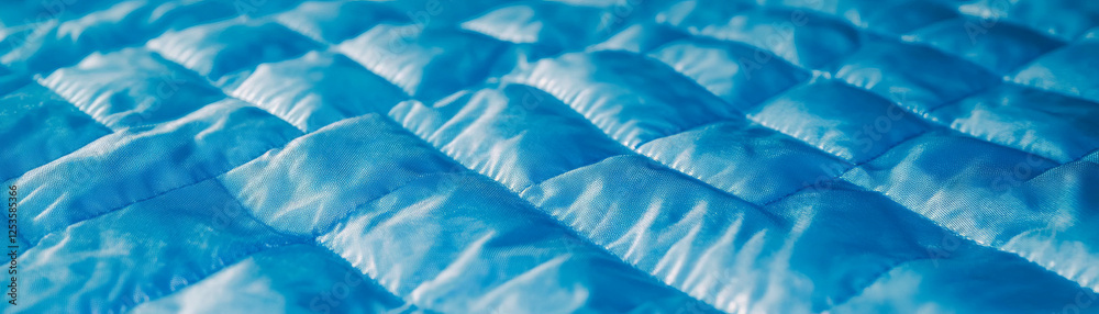 Poster Macro texture of quilted fabric showcasing intricate stitched patterns and padded design