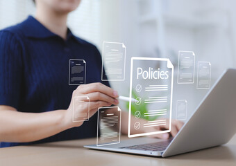 Online policy document management concept. A person interacting with digital policies documents on a laptop, symbolizing online documentation, governance, compliance, digital information management,