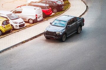 Black pickup truck on urban street