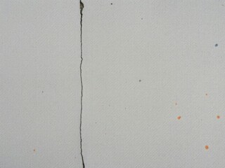 Weathered concrete with scattered paint droplets, worn, weathered, textured