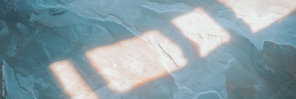Poster textured venetian plaster with soft light and subtle shadows against a bright backdrop