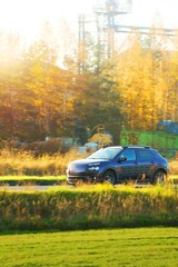 Family car driving in rural setting