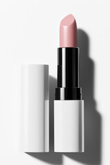 Obraz premium Close-up image of a pink lipstick in a white case