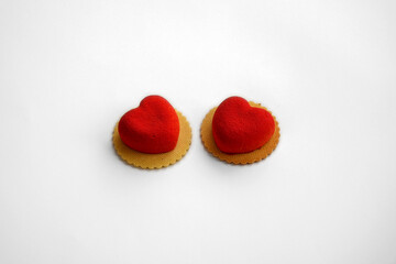 Two red heart-shaped desserts, a sweet treat for Valentine's Day
