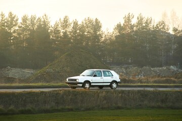 Classic car driven in rural area