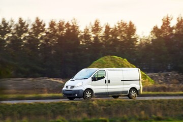 White van on country roadside