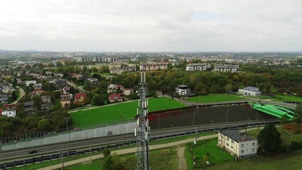 Cellular tower against cloudy sky landscape.