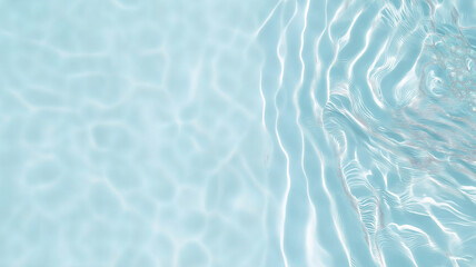 Obraz premium Light blue transparent water surface with gentle ripples reflecting sunlight