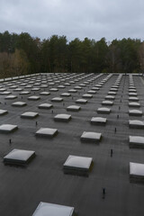 Fototapeta premium Top view of a modern roof with natural light. Skylights. Energy efficiency. Transparent panels on the roof. High quality photo