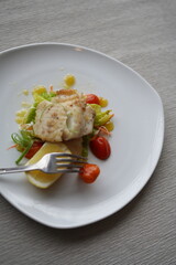 Gourmet Plate of Salmon Fish with Vegetables and Lemon