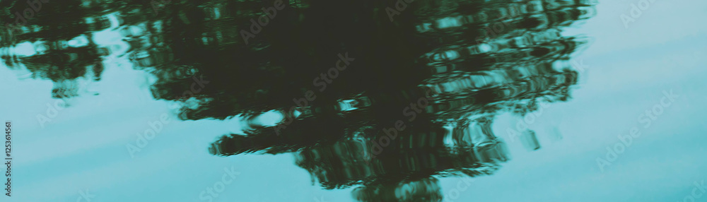 Poster Tree reflections create abstract shapes in still water with halftone texture