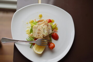 Plated Salmon Fish Dish with Vegetables and Garnish