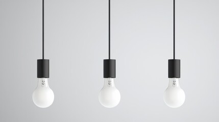 Three Hanging Light Bulbs Against Gray Background
