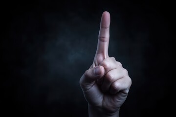 Human Hand Gesture with Index Finger Pointing Upwards in Dark Background