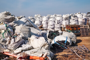 large chemical sacks filled with drawers and other plastic waste for recycling