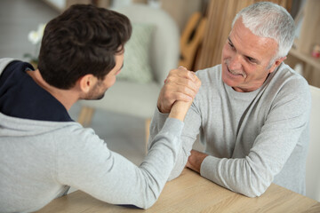 Fototapeta premium two middle aged men arm wrestling