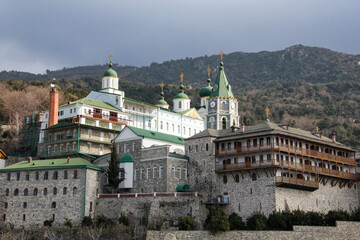 Fototapeta premium Best places to visit in Greece. Traveling and pilgrimage to the Orthodox places of Athos. Panoramic view of Russian St. Panteleimon's Orthodox monastery at Mount Athos