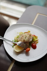 Elegant Salmon Fish Dish with Salad and Tomatoes
