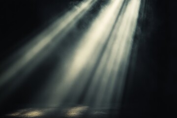 Light beams shining through smoke on dark background creating a mysterious atmosphere