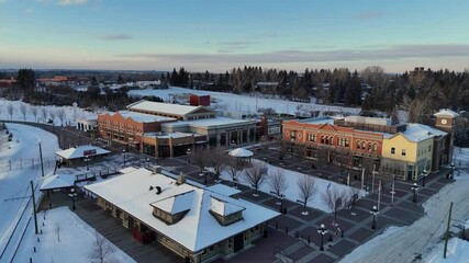 Winter fly over of Heritage Park historical village on a beautiful winter evening. 