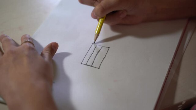 School, classroom and boy kid writing, drawing and learning art, color or lesson for skills and child development. Children, education and male student with notebook for creative assessment or sketch