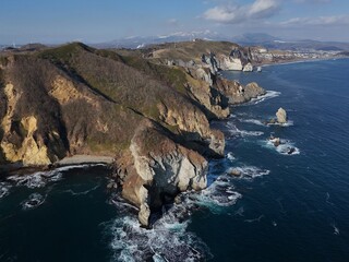 Aerial view of Cape Chikyu with rough sea breaking on cliff