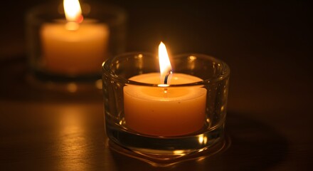 Frame-filling macro of a candle flame in a heart-shaped glass holder