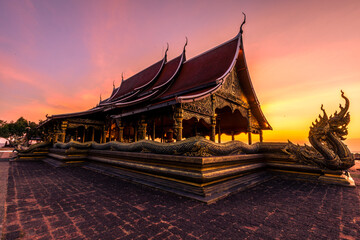 Background of the tourist attraction Wat Sirindhorn Wararam or the famous glowing temple in...
