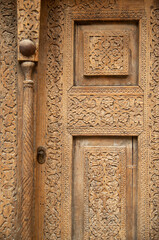 Part of ancient carved wooden door closeup in Uzbekistan, Asia