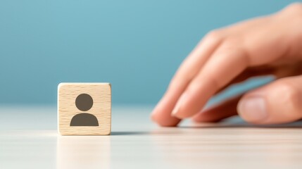 Hand pushes wooden block with face, a symbolic depiction of struggle, identity, and manipulation in surreal world