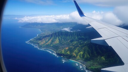 Fototapeta premium A view from an airplane window of the wing, azure ocean, scenic coastline with green mountains and clouds, evoking a sense of travel, adventure, and aerial photography.