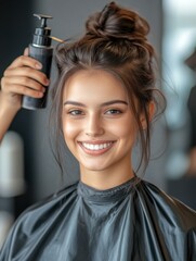 Fototapeta premium beauty, hairstyle and people concept - happy young woman with hairdresser with hair spray fixating hairdo at salon