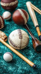 Vintage baseballs and bats on teal background. Possible use Sport history stock photo