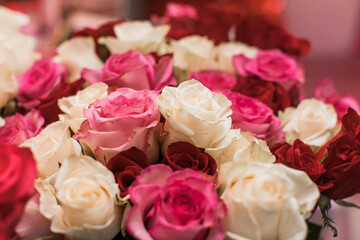 beautiful bright closeup bouquet of pink, red, white roses 