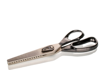 One tailor's scissors, close-up, isolated on a white background.