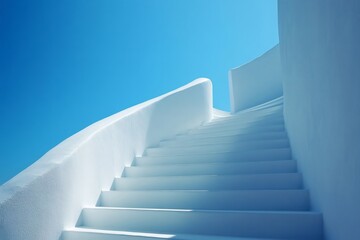 Whitewashed staircase ascending under blue sky in santorini, greece