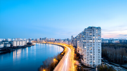 Obraz premium Cityscape at Dusk Riverfront Apartments and Highway