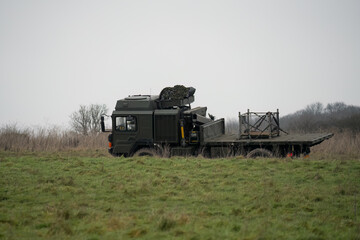 Naklejka premium British army MAN SV 4x4 logistics truck driving an unmade road