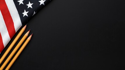 Fototapeta premium American Flag with Pencils on Dark Background