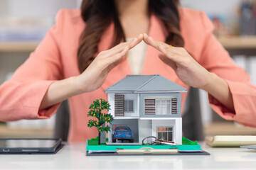 Real estate agent is offering insurance to protect the house when customer signs real estate...