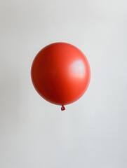 Red Balloon Floating Isolated on White Background for Minimalist Advertising and Creative Projects