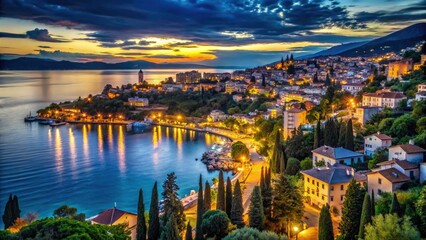 Fototapeta premium High-angle view: Opatija's shimmering, night-lit coast, bokeh effect.