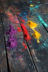 Fototapeta premium Holi powders spread on wood