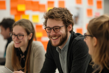 Fototapeta premium Young professionals laughing during creative brainstorming