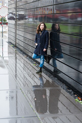 Molenbeek Port district, Brussels  Belgium - 01 04 2020 Attractive brown haired girl walking in the...