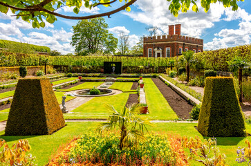 Little banqueting house in Privy gardens of Hampton Court palace in spring, London, UK