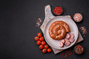 Delicious homemade sausage in the shape of a snail or spiral © chernikovatv