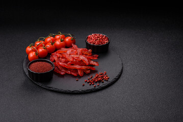 Dried chicken slices, jerky, with cherry or plum flavor, salt and spices