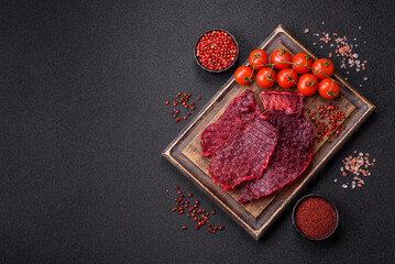 Dried beef slices, jerky, with cherry or plum flavor, salt and spices