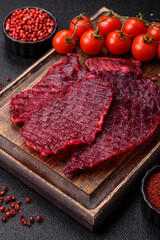 Dried beef slices, jerky, with cherry or plum flavor, salt and spices